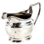 A George III silver cream jug, with a reeded border and an angular handle, London 1807, 3oz.