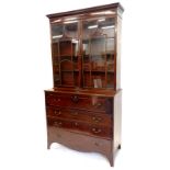 A George III mahogany secretaire bookcase, the top with a dentil cornice above too astragal glazed