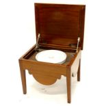 A 19thC mahogany box commode, the hinged lid enclosing a ceramic insert, on square tapering legs,