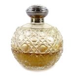 A George V cut glass globular scent bottle, with silver collar and top, the top cast with berries