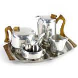 A Picquot ware aluminium four piece tea set, a similar Cavalier cruet and a Danish stained stainless
