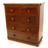 A Victorian mahogany chest of drawers, top with rounded corners above two short and three long