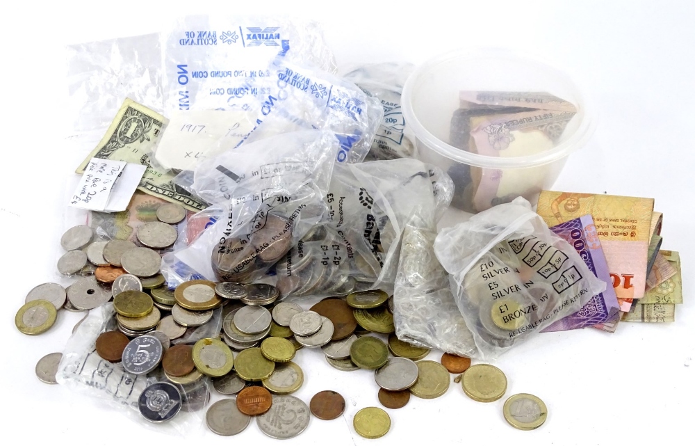 A quantity of British and foreign coins and bank notes.