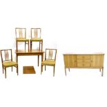 A Gordon Russell of Broadway walnut dining room suite, comprising sideboard with moulded edge, three