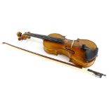 A 20thC violin, with one piece back, length of back 35.5cm and a bow.