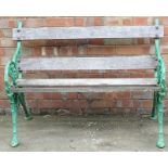 A cast iron two seat garden bench, decorated with flowers, leaves, etc., 119cm wide.