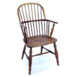 A Wilson of Grantham 19thC ash and elm Windsor chair, with turned spindle back, solid seat and