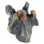 An unusual 19thC carved horse's vertebrae, decorated in the form of John Wesley, 14cm high.