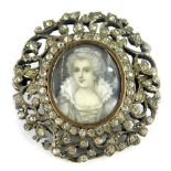 A Victorian paste stone set portrait brooch, with central oval portrait panel of a lady in Victorian