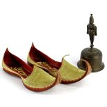 A pair of Eastern leather shoes or slippers, each elaborately decorated in gilt and an Indian