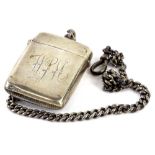 A late Victorian silver Vesta case, engraved with monogram WPM, and a silver chain Birmingham