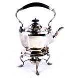 A silver plated tea kettle on stand with spirit burner, with composite handle and knob, the base