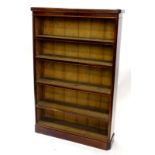 A Victorian mahogany open bookcase, the top with rounded corners above five shelves on plinth