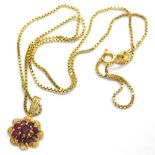 A 9ct gold cluster ruby pendant, and 18ct gold chain, with a central ruby approx 4.5mm, surrounded