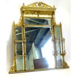 A late 19thC gilt gesso over mantle mirror, the top with a bow front cornice above an arrangement of