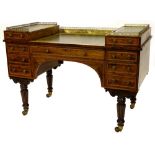 An unusual early Victorian rosewood and satinwood banded desk, the stepped top with a pierced