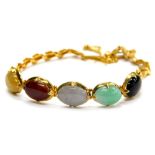 A multi stone set bracelet, set with five oval semi precious stones, in a claw setting, in