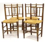 A set of four late 18th/early 19thC ash spindle back dining chairs, each with a rush seat, on turned