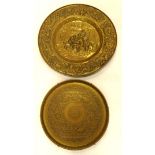 An Indian engraved brass circular tray, 50cm diameter, and an embossed Dutch style charger.