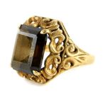 A 9ct gold dress ring, set with rectangular cut smoky quartz, within four claw setting, and scroll