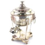 A 19thC silver plated tea urn, with lion mask side handles and a shaped spout with ceramic insulator