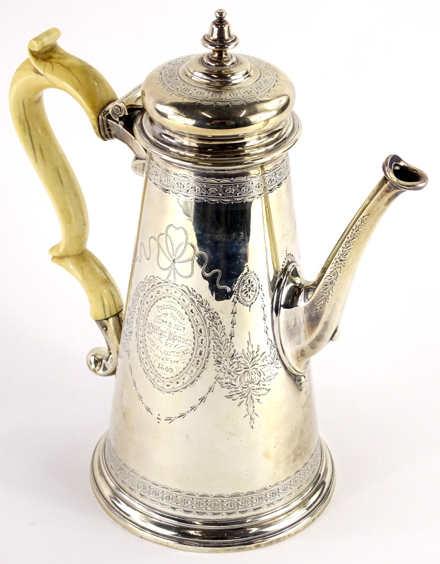 A George II silver coffee pot, of tapering form, later engraved overall with ribbons, leaves and