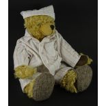 A Bedtime teddy bear, limited edition number 12/250, titled Bedtime Bear.