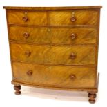 A Victorian mahogany bow fronted chest of drawers, the top with a plain edge above two short and