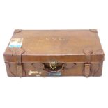 A leather suitcase, bearing initials M.A.S, paper label (AF).
