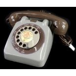 A late 1950's GPO grey telephone, with on/off bell switch.