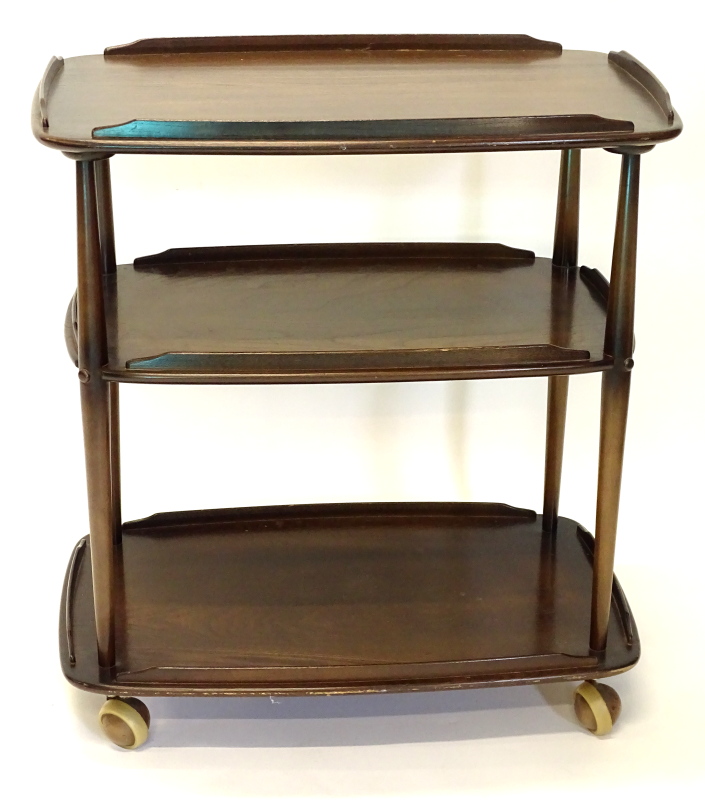 An Ercol elm and beech three tier galleried trolley, on large castors, 77cm high, 69cm wide.