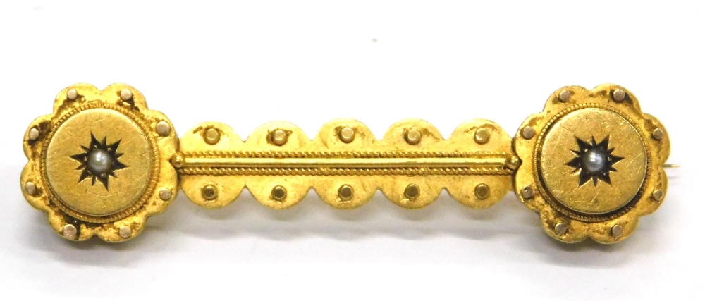 A Victorian bar brooch, with reeded and dot design, set with a single seed pearl at each end, yellow