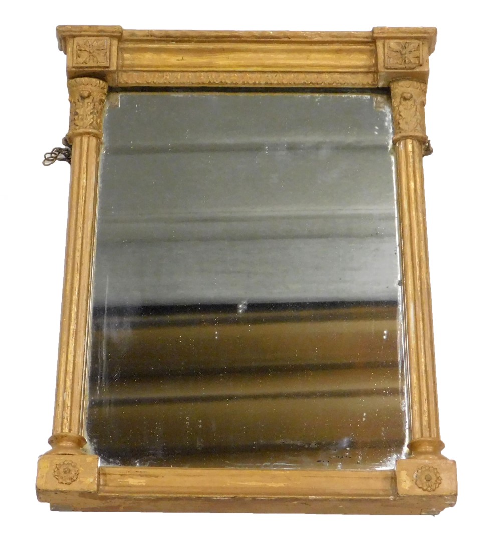 A 19thC gilt gesso overmantel mirror, the rectangular plate flanked by fluted columns, 52cm x 39cm.
