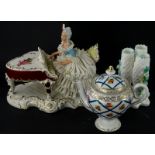 A Dresden porcelain crinoline figure group, of a lady playing a piano, 20cm wide, a continental