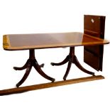 A mahogany, satinwood and tulipwood cross banded dining table, in Regency style the rectangular