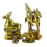 A collection of Eastern brass sculptures to include, a cow, a figure on horseback, an Elephant and a
