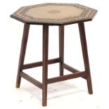 A late 19th/early 20thC walnut occasional table, the octagonal top with chip carved decoration and