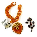 Two items of jewellery, comprising a faux amber pendant and chain, with yellow metal mount, a