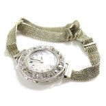 A ladies diamond set platinum wristwatch, on an 18ct white gold bracelet, unmarked, with round