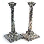 A pair late 19thC Elkington & Co column candlesticks, each decorated with swags on a square base,