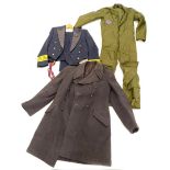 A set of Royal Air Force type green overalls, heavy grey gentleman's overcoat, and an RAF uniform
