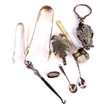 A collection of small silver etc., to include a pair of Victorian sugar tongs, a pair of early 20thC