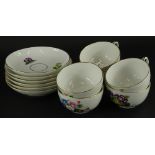 A Royal Copenhagen part tea service, decorated with specimen flowers, the saucers 16.5cm diameter,