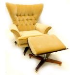 A 1960's G Plan type revolving wing armchair, with buttoned upholstery on 'X' shaped rosewood base