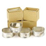 A set of four modern silver D shaped napkin rings, Birmingham 1941, three in original wrappers, 1¼oz