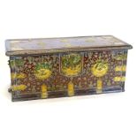 An Eastern Zanzibar type hardwood chest, the hinged lid enclosing a vacant interior with candle box,
