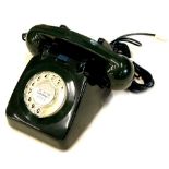 A 1960's GPO 706 black telephone, with bell on/off switch.