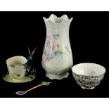 A Franz porcelain cup, saucer and spoon, decorated with humming birds, numbered FZ00129, an