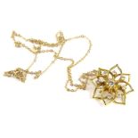 An 18ct gold floral diamond pendant and chain, with openwork flower design, set to the centre with