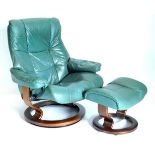 A Stressless green leather adjustable armchair, on a laminated support and circular base, with